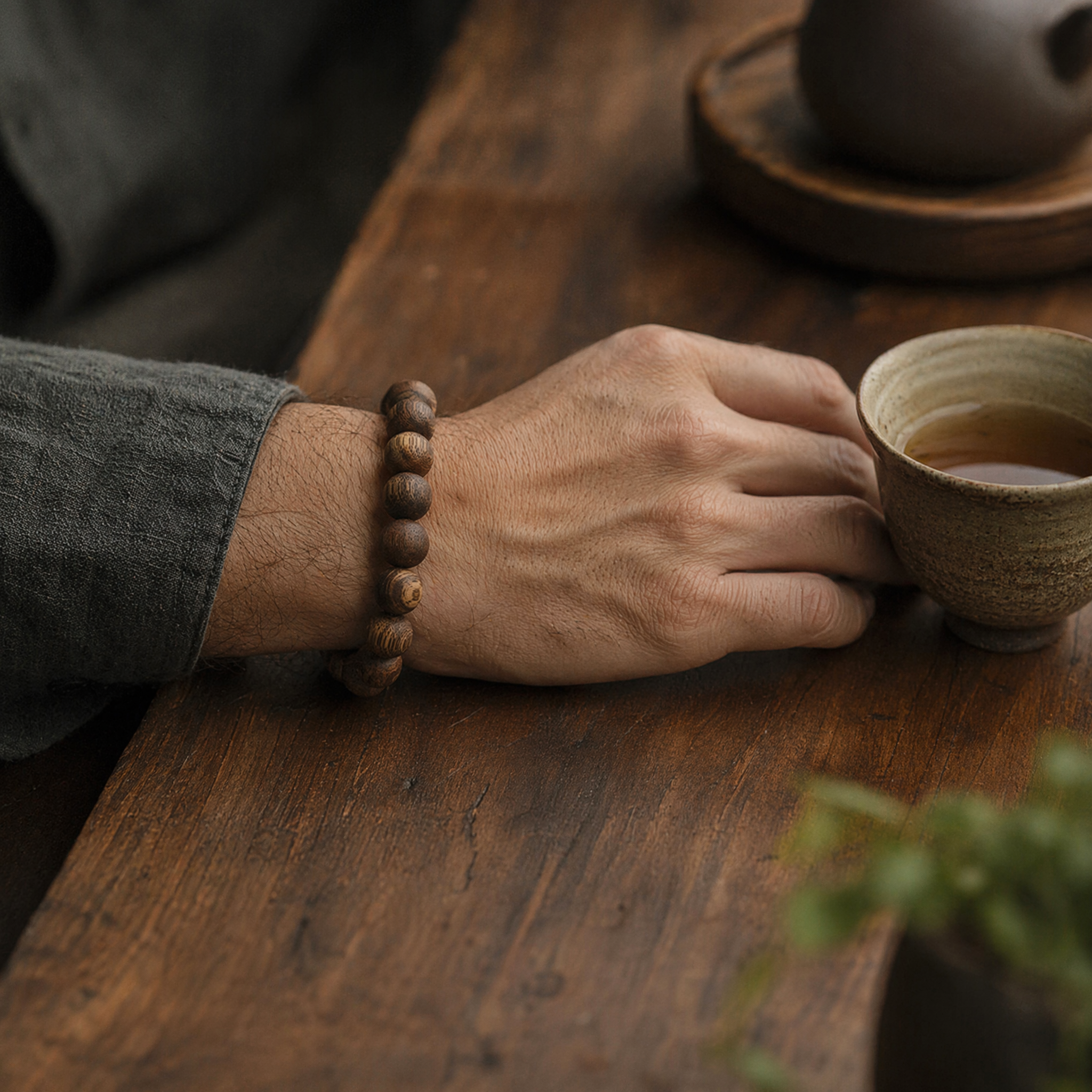 Man wearing classic agarwood round bead bracelet