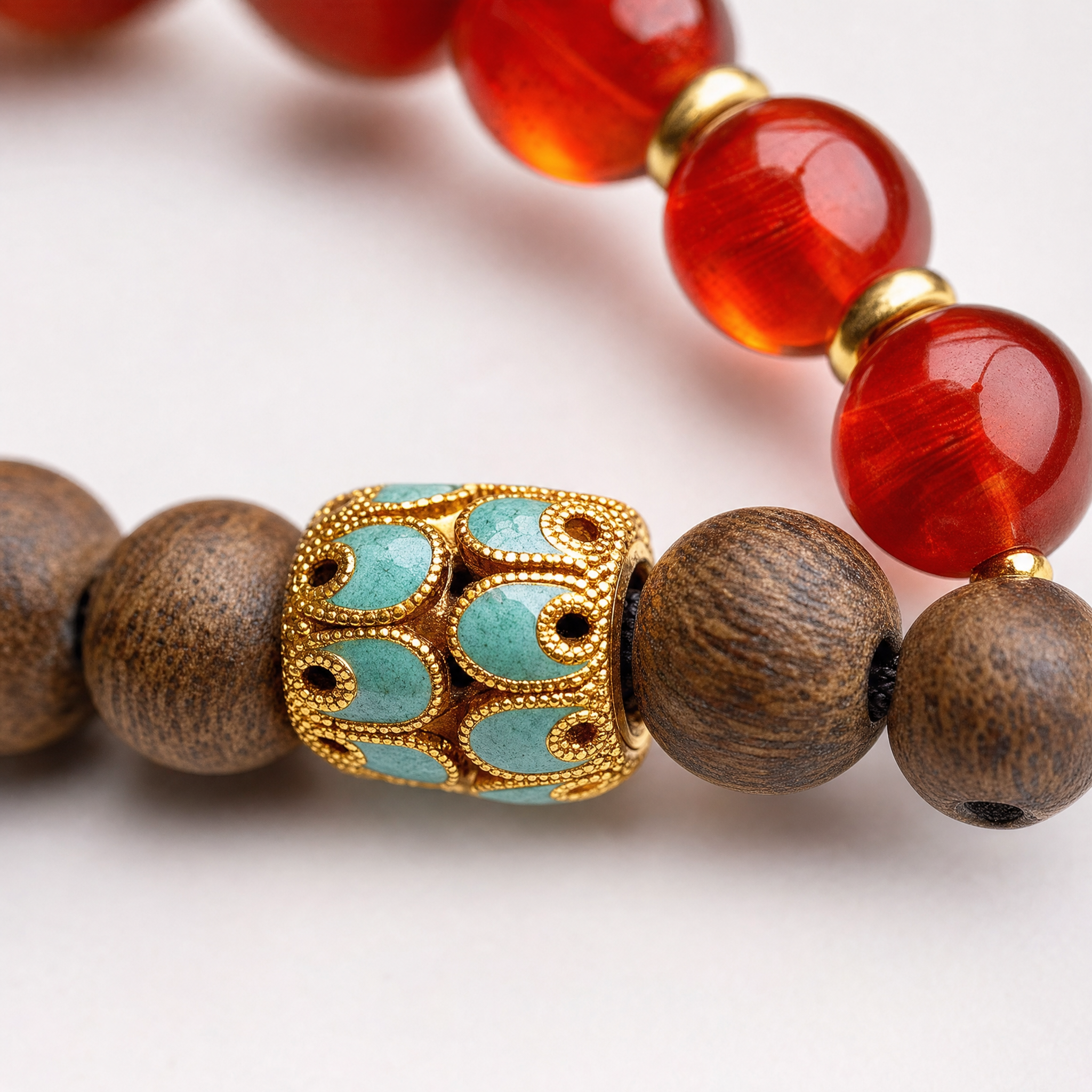 Close-up of agarwood bracelet with red accent beads