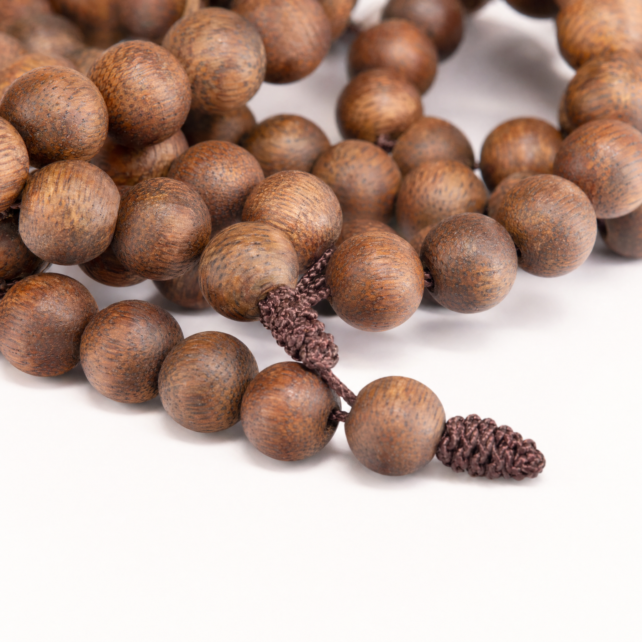 Close-up of 108-bead agarwood mala bracelet
