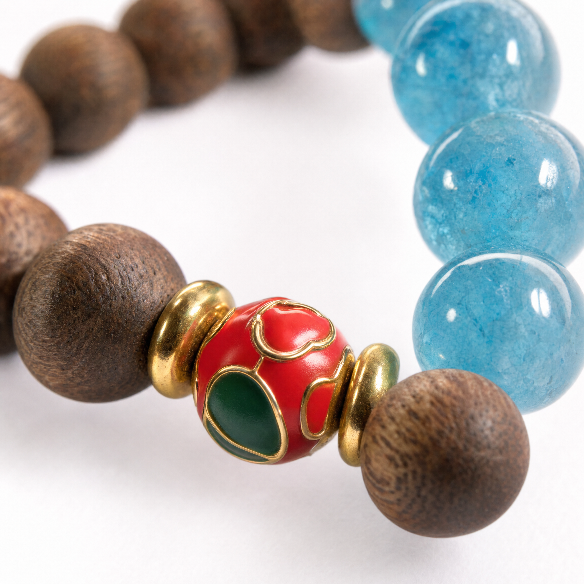 Close-up of agarwood bracelet with blue crystal accent beads