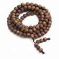 108-bead natural agarwood mala wrap bracelet on white background