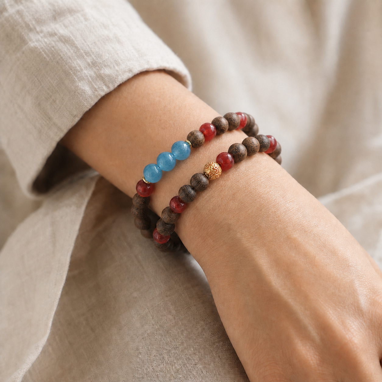 Model wearing one continuous agarwood bracelet wrapped twice around the wrist